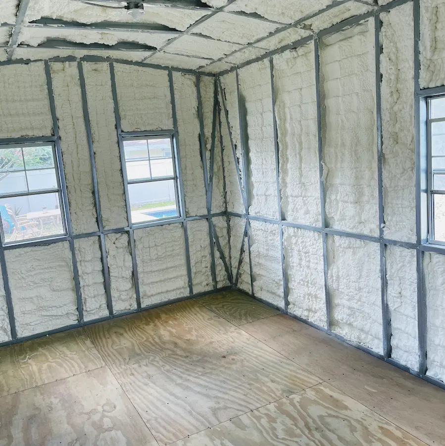 Closed-cell spray foam insulation applied to wall cavities in a residential project in Indianola